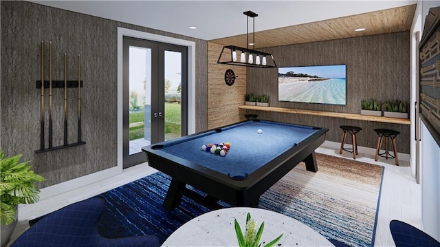 recreation room featuring french doors, pool table, hardwood / wood-style flooring, and a healthy amount of sunlight