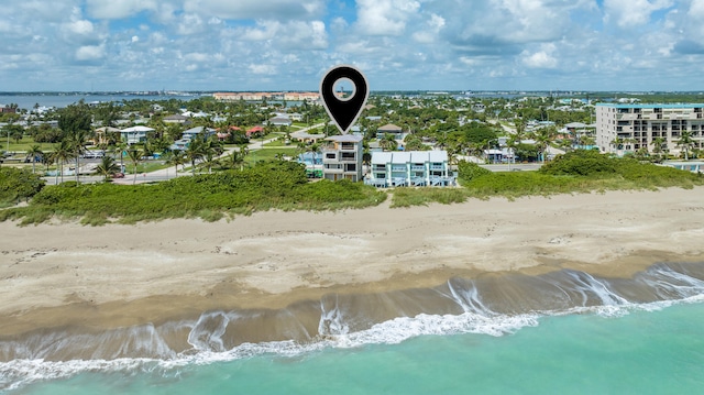 bird's eye view featuring a view of the beach and a water view