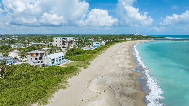 bird's eye view featuring a beach view and a water view