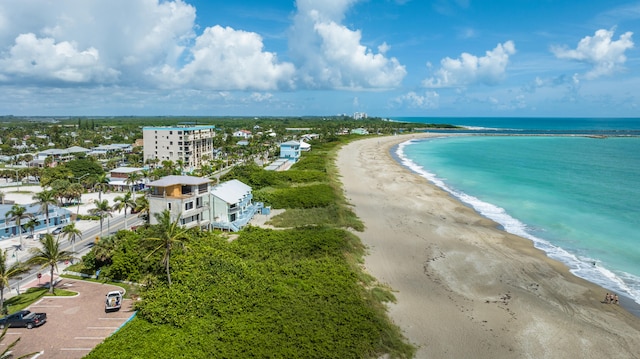 bird's eye view featuring a view of the beach and a water view