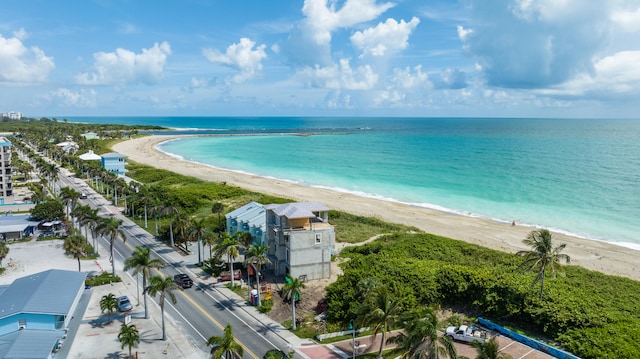 bird's eye view with a view of the beach and a water view