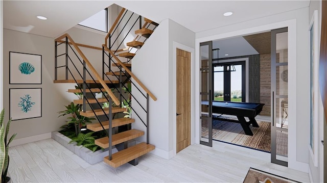 staircase with pool table, wood-type flooring, and french doors