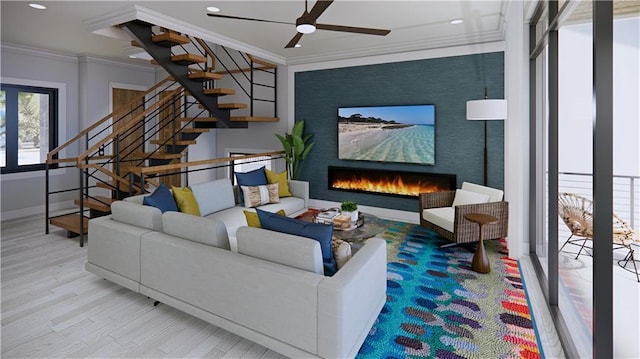 living room featuring light wood-type flooring, ornamental molding, and ceiling fan