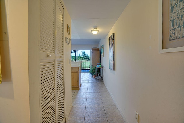 hallway featuring light tile flooring