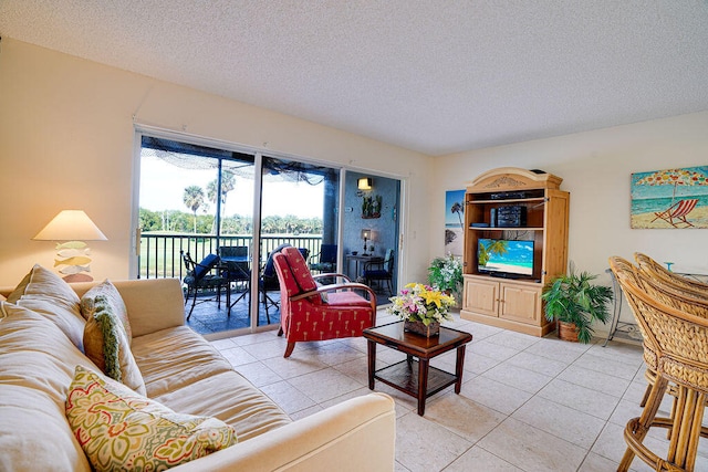 living room featuring a textured ceiling and light tile flooring