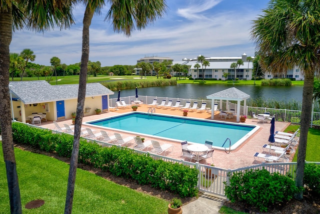 view of swimming pool with a lawn and a patio area