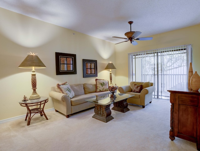 carpeted living room featuring a textured ceiling, ceiling fan, and baseboard heating