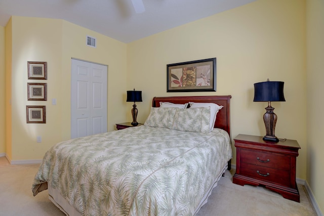 carpeted bedroom featuring a closet and ceiling fan