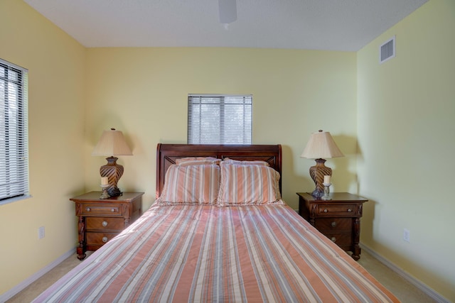 bedroom featuring ceiling fan and light colored carpet