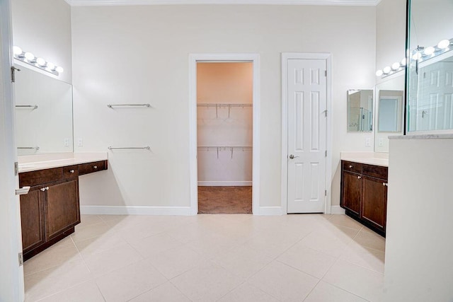 bathroom with tile patterned flooring and vanity