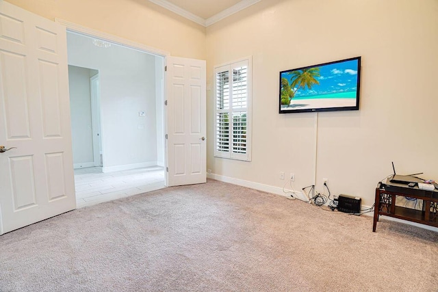 carpeted bedroom featuring crown molding