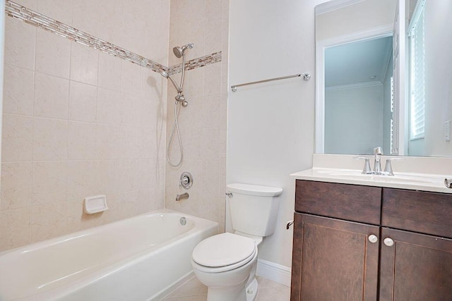 full bathroom with vanity, tile patterned flooring, tiled shower / bath, and toilet