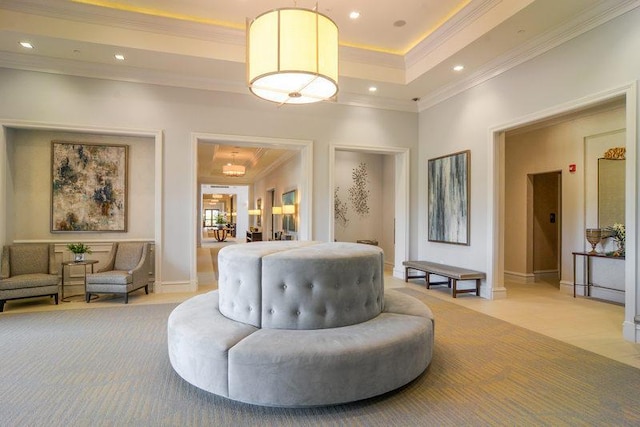 sitting room with light carpet, crown molding, and a raised ceiling