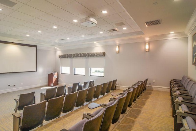 home theater with ornamental molding and light carpet