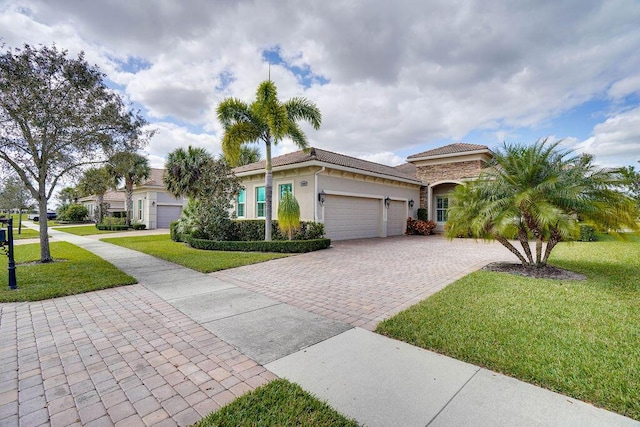 view of front facade featuring a front yard and a garage