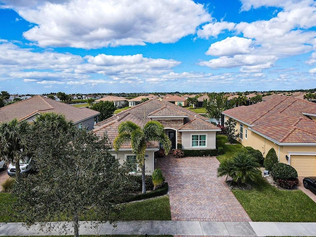 mediterranean / spanish-style home featuring a front yard