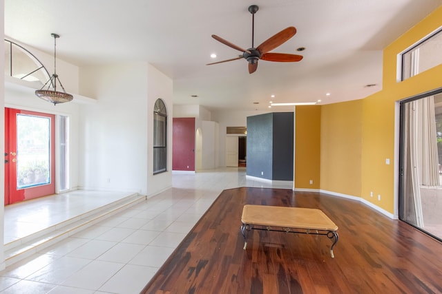 entryway with ceiling fan and light hardwood / wood-style floors