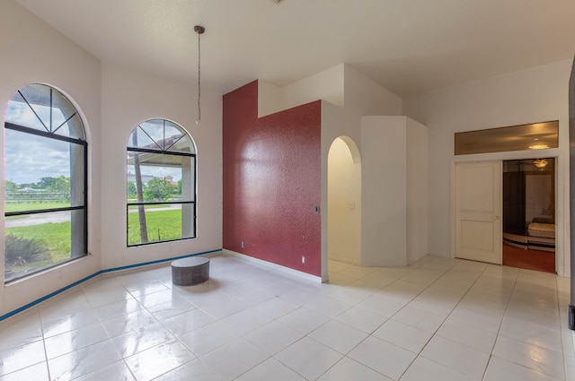 spare room with light tile patterned flooring