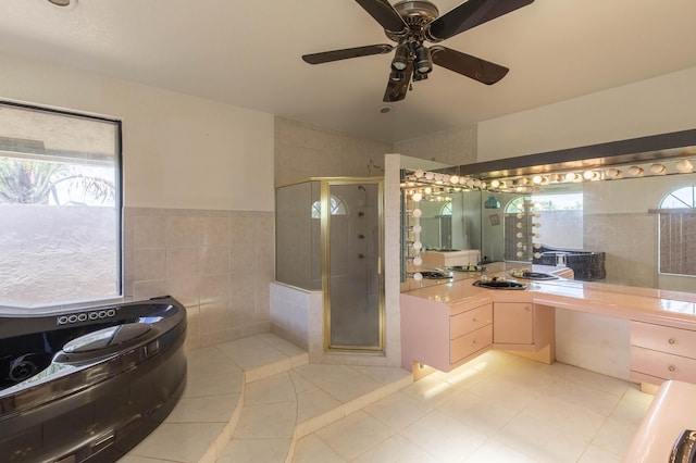 bathroom featuring an enclosed shower, tile walls, vanity, ceiling fan, and tile patterned flooring