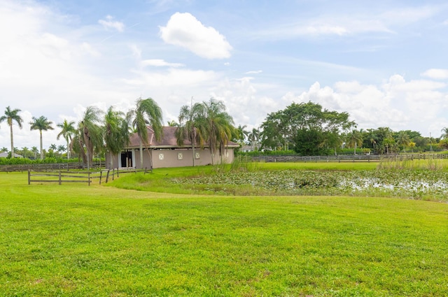 view of yard with a rural view