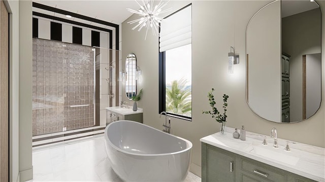 bathroom with a tub, an inviting chandelier, tile patterned floors, and dual bowl vanity