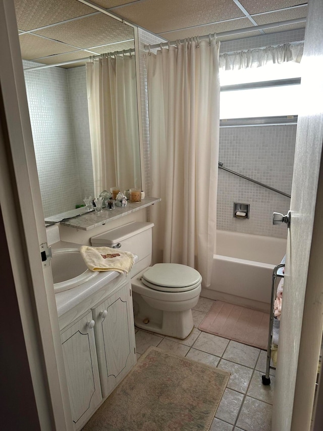 full bathroom with toilet, shower / tub combo, vanity, and tile flooring