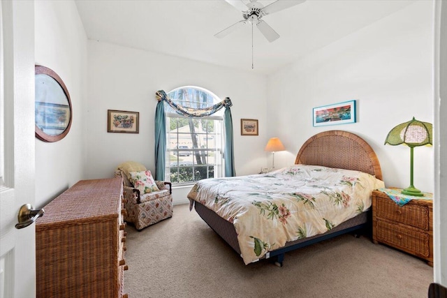 bedroom with light carpet and ceiling fan