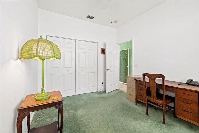 carpeted office with ceiling fan