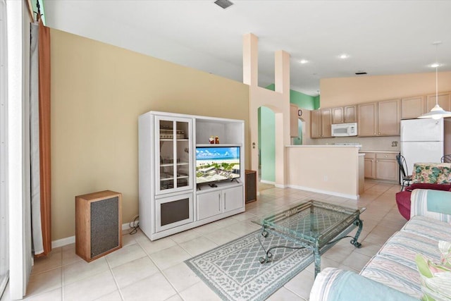 tiled living room featuring vaulted ceiling