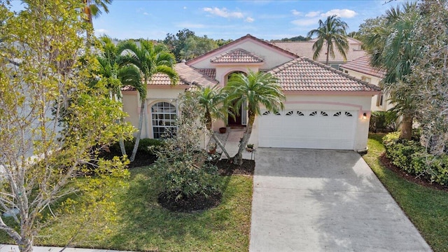 mediterranean / spanish house featuring a garage