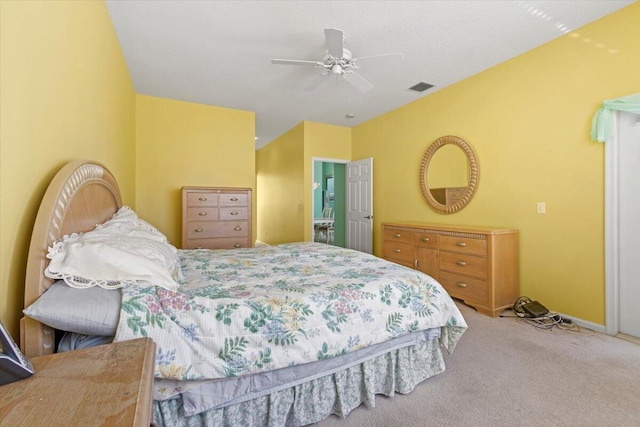 bedroom featuring light carpet and ceiling fan