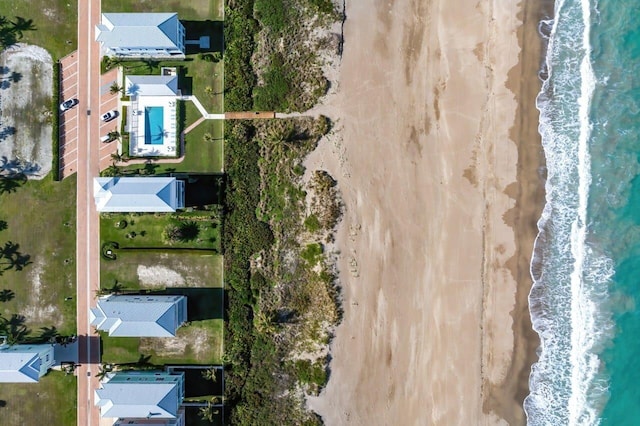 bird's eye view with a water view and a view of the beach