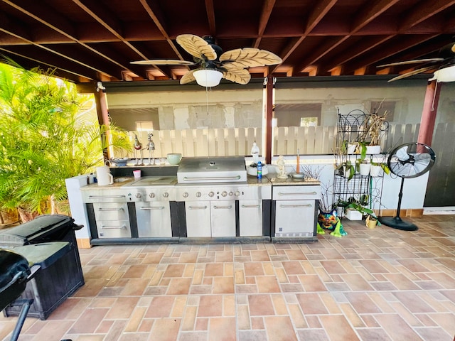 view of patio featuring area for grilling and ceiling fan