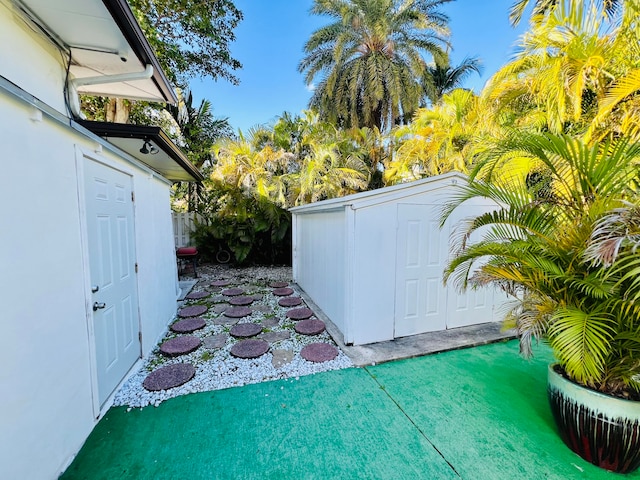 view of patio / terrace with a shed