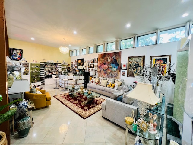 tiled living room featuring an inviting chandelier