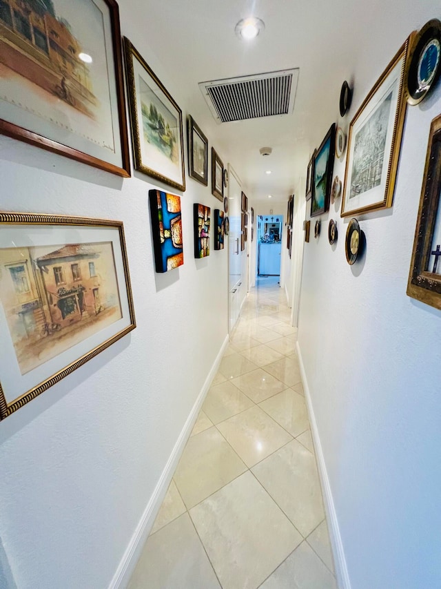 hallway with light tile flooring