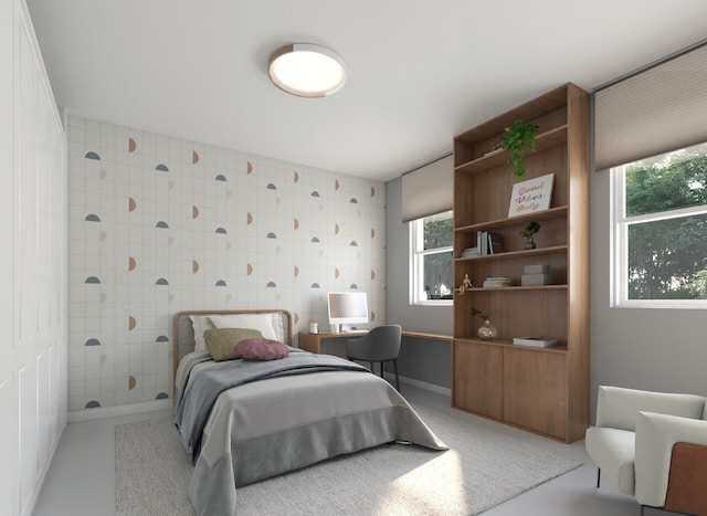 bedroom featuring multiple windows and tile walls