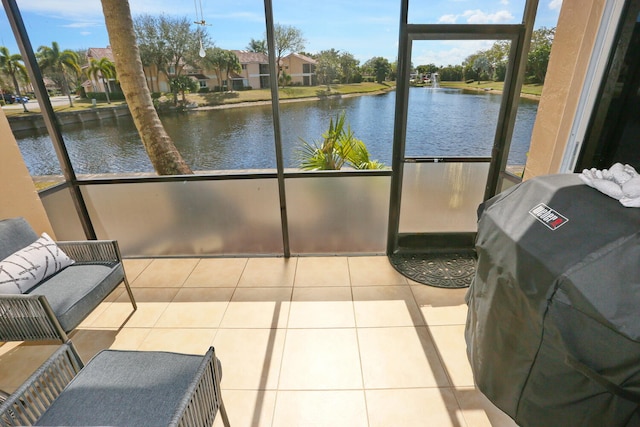 sunroom with a water view