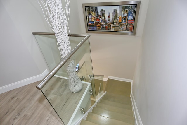 stairway featuring light hardwood / wood-style flooring