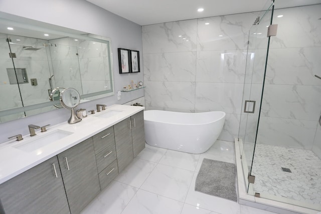 bathroom featuring double sink vanity, tile walls, plus walk in shower, and tile floors