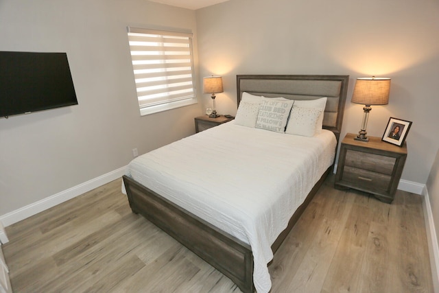 bedroom with light hardwood / wood-style floors