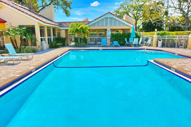 view of swimming pool with a patio