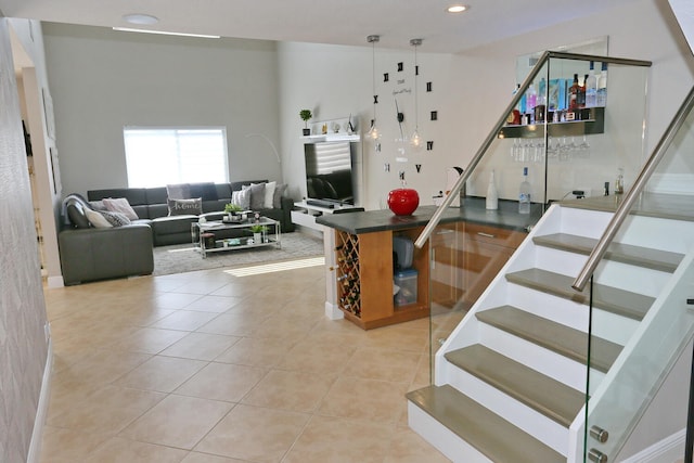 stairs featuring light tile flooring