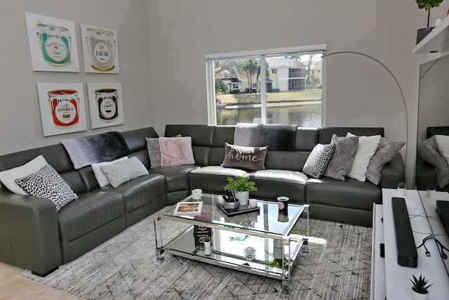 tiled living room with a water view