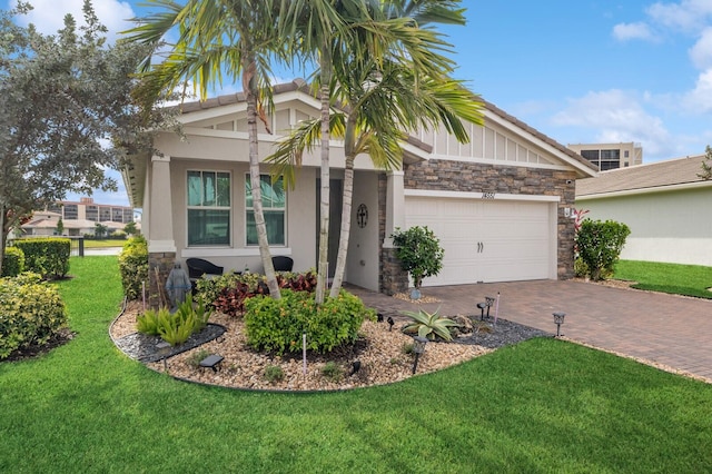 craftsman house with a front lawn and a garage