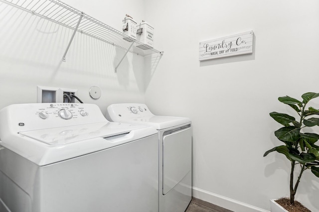 clothes washing area featuring washing machine and dryer and hookup for a washing machine