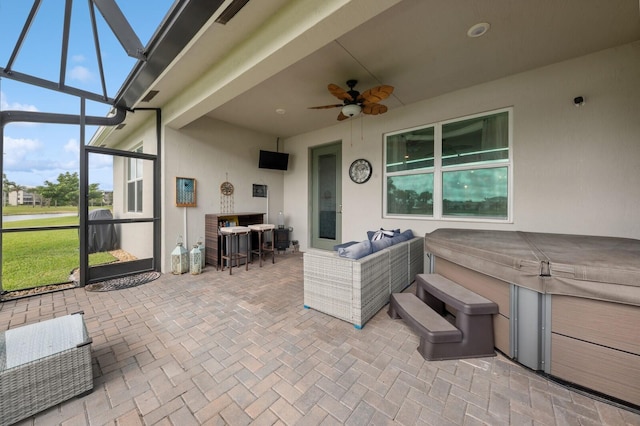 view of terrace featuring an outdoor living space, ceiling fan, and a lanai