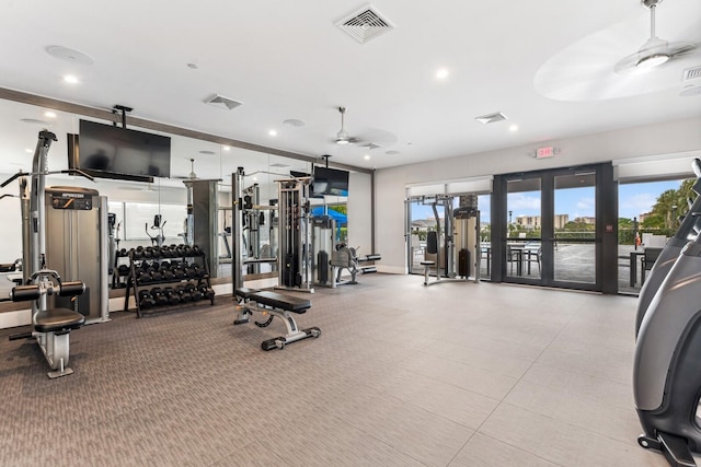 workout area featuring french doors, ceiling fan, and light tile floors