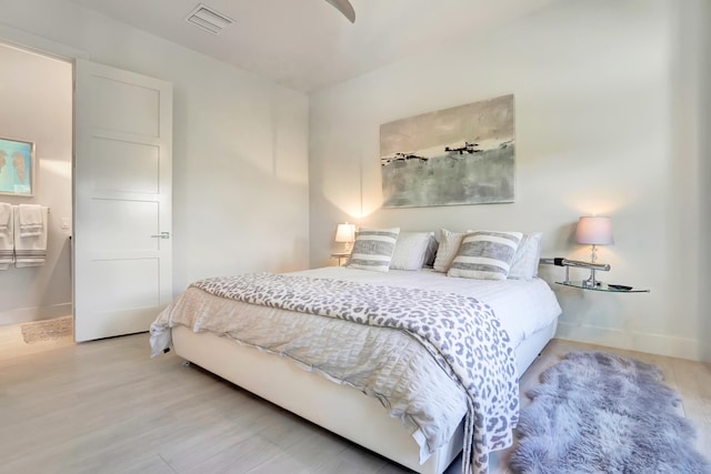 bedroom with wood-type flooring and ceiling fan