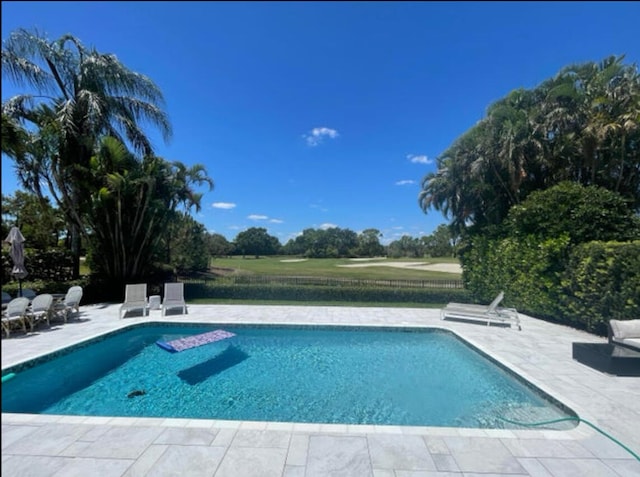 view of swimming pool featuring a patio